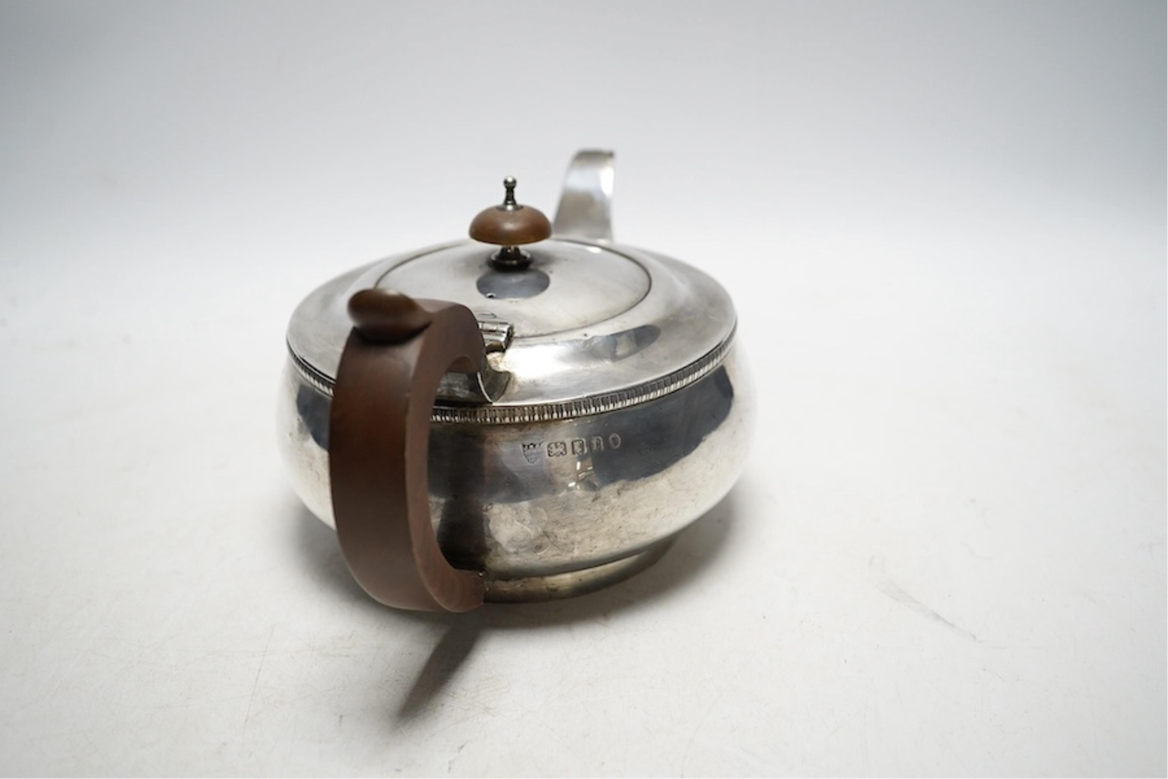 A George V silver teapot, JBC and S Ltd, London 1934, 595g gross. Condition - fair